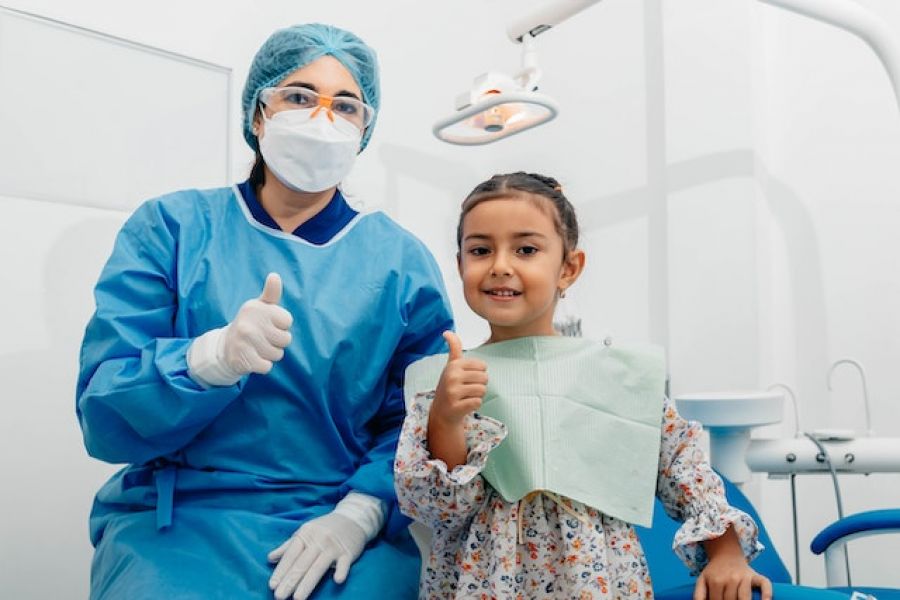 photo of a dentist and a child
