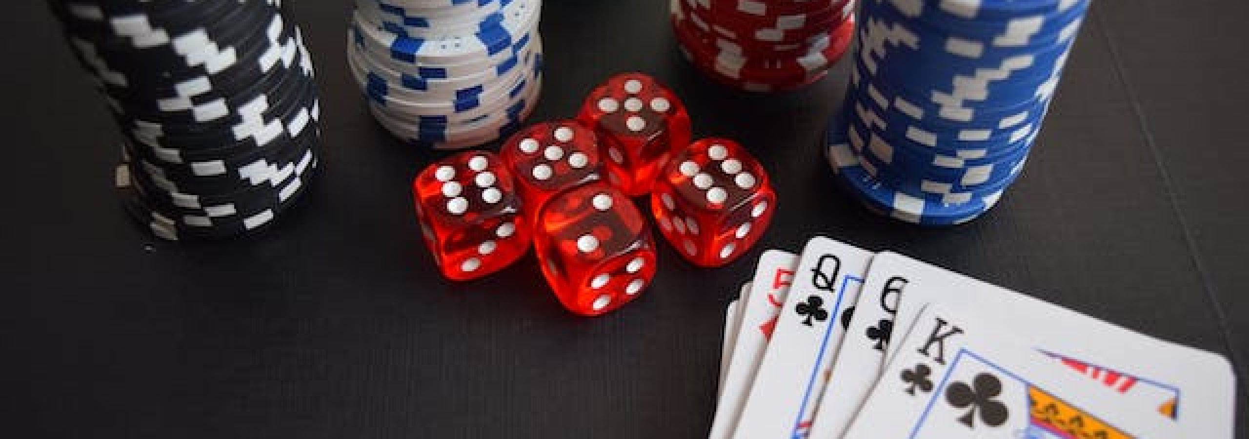 photo of chips and dice at casino